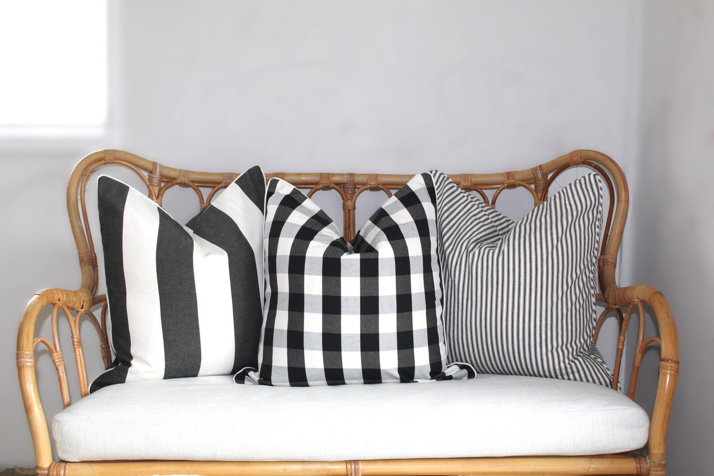 Black and white check and striped cushion covers