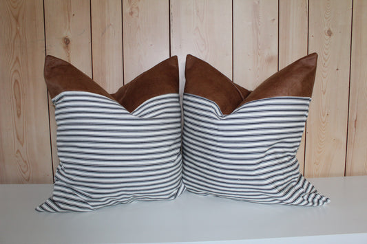 Pair of faux leather cushion covers